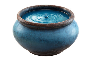 A clay pot filled with a vibrant blue liquid