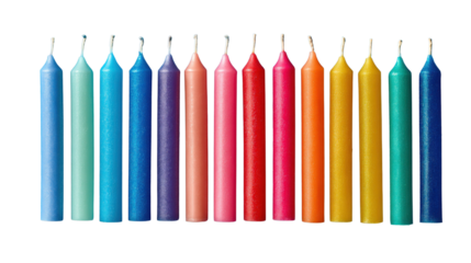 Row of colorful candles arranged neatly in a straight line representing celebration festive atmosphere decoration and cheerful mood on white background