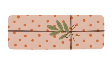 A single, long, rectangular gift box wrapped in light pink paper with orange polka dots and a green leaf sprig isolated on transparent background