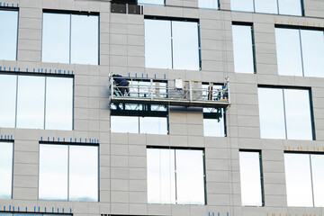 high platform elevator crane industrial construction occupation work by builder man person for external building side background space