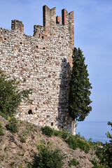 The stone ramparts of the medieval Padenghe Castle on Lake Garda