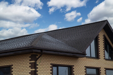 Soft roof, flexible shingles. Installation of soft tiles on the roof.
