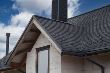 Soft roof, flexible shingles. Installation of soft tiles on the roof.
