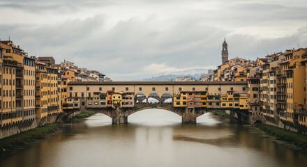 Naklejka premium Iconic Ponte Vecchio landmark in Florence Italy. Medieval cityscape with ancient architecture over the Arno River. European travel destination for tourism and cultural heritage