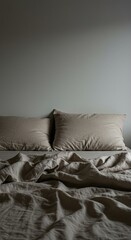 Comfortable unmade bed with natural linen sheets and soft pillows, inviting a serene and peaceful sleep experience in a cozy bedroom ,relaxation ,bedding ,peaceful atmosphere