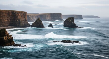 Rugged coastal cliffs and sea stacks on a dramatic shoreline. Powerful ocean waves with white foam breaking on rocks. Wild northern seascape for travel and adventure. Natural power and untamed beauty