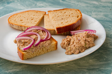 Fish pate with bread on plate