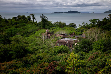 Old abandoned hotel in the jungle. Shabby walls. Beautiful abandoned hotel.	