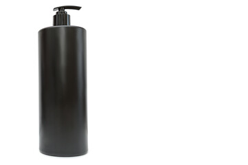 A black plastic container for liquid on a white background. Space for text.