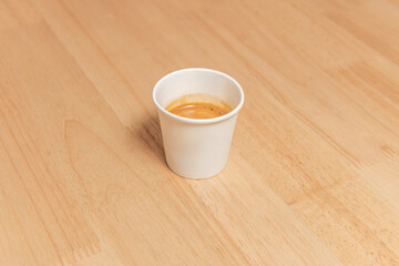 Flat white with silky microfoam and a rosette design in a contemporary matte black porcelain cup.
