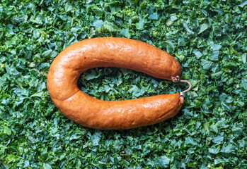 Smoked sausage and Kale, ingredients for dutch winter dish known locally as Boerenkool met rookworst