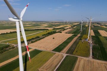 Wind turbine installation using a large construction crane. The assembly process of the turbine...