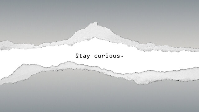 Motivational quote &ldquo;Stay curious&rdquo; on torn paper background. Minimal modern design encouraging creativity, curiosity, and lifelong learning.