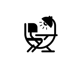 Chair and desk with lamp on