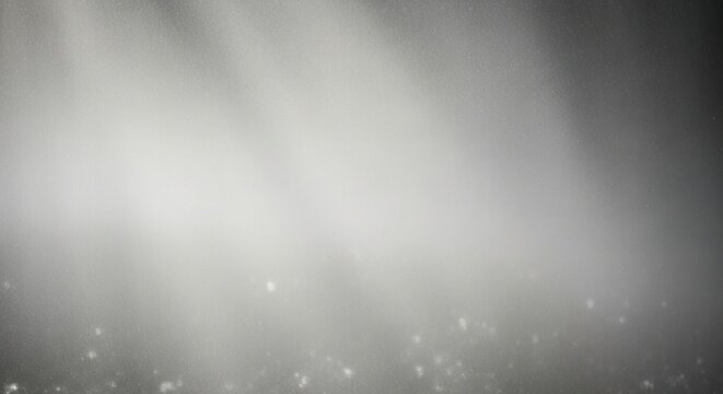 Silver glitter background features a soft light creating an elegant and magical atmosphere perfect for festive designs holiday cards or any project needing a touch of subtle sparkle and refined beaut