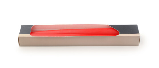 Candles in a cardboard box isolated on white.