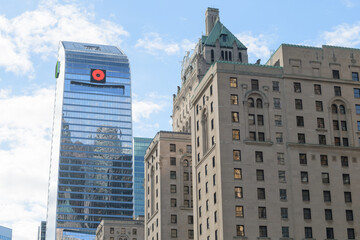 Fototapeta premium architecture contrast: TD Terrace and Fairmont Royal York hotel on Front St W, Toronto