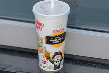 Naklejka premium McDonald's Canada beverage cup with Monopoly promotional event graphic design outdoors in Toronto