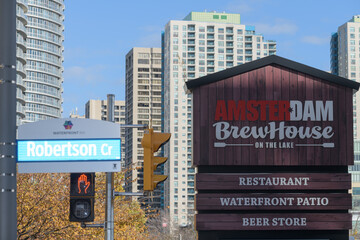 Fototapeta premium view of sign near Amsterdam Brewhouse, a brewpub, located at 245 Queens Quay W, Toronto (at Robertson Cr)