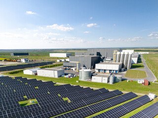 Modern green factory powered by renewable  energy. Sustainable development in industry