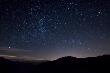 Fototapeta premium Night sky full of stars above dark mountains
