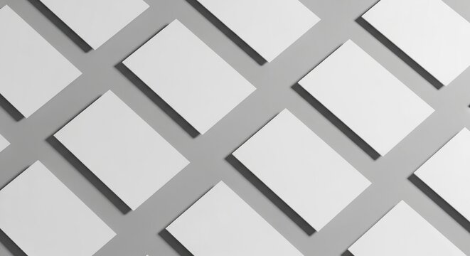 Clean white cards arranged diagonally on a solid gray background creating a modern, minimalist template for branding or design projects.