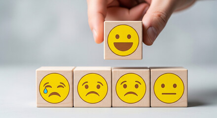 Hand chooses a smiling face on wood block cube, positive attitude selection concept