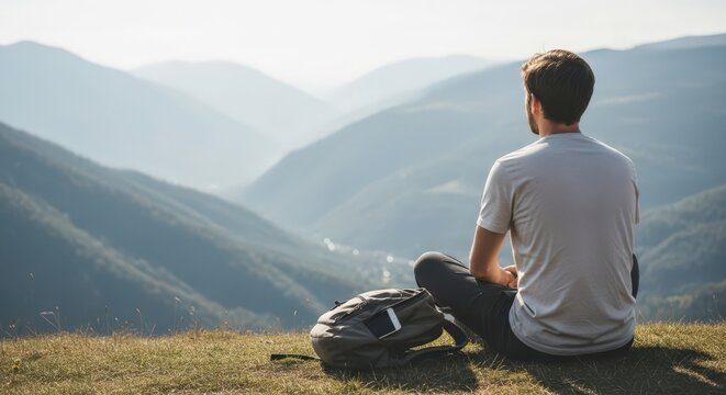 Man enjoying peaceful mountain retreat for digital detox