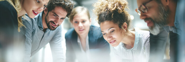 Focused team of professional business people in group meeting. Their collaboration and teamwork in office show creative brainstorming for new project