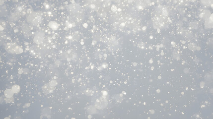 Abstract winter background with gentle falling snow and lucid bokeh lights, a magical and serene conceptual scene for festive design