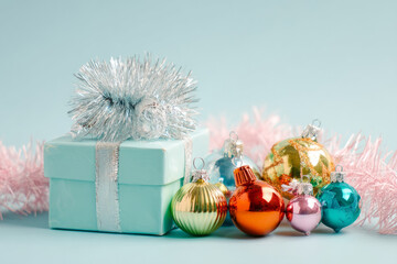 Christmas baubles and wrapped gift box. Holiday still life with vintage decoration elements