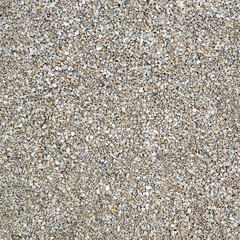 Seamless texture of grey macadam at daylight.
