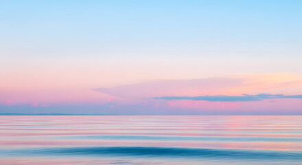 Fototapeta premium Pastel colors of sky and water creating serene seascape with tranquil horizon light tones reflecting in calm waves expressing peace quiet and tranquility
