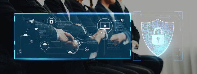 Business professionals engage in a meeting focused on enhancing cybersecurity measures using advanced digital technology and strategic data protection concepts. Trope
