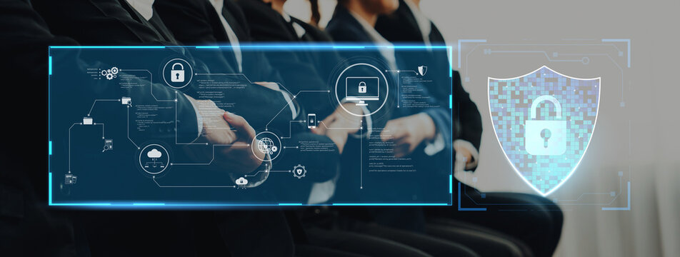 Business professionals engage in a meeting focused on enhancing cybersecurity measures using advanced digital technology and strategic data protection concepts. Trope