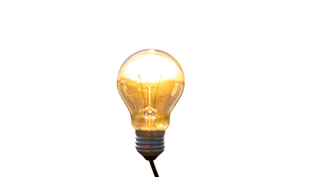 A bright, glowing incandescent lightbulb shines against a stark black background