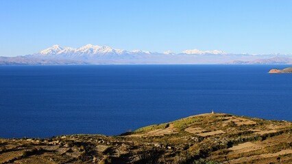 Panoramic view from Isla del Sol (Island of the sun) over agricultural terraces, Lake Titikaka in...