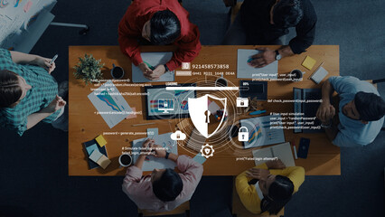 A diverse team engages in a meeting to discuss data security strategies, focusing on password protection and digital security using technology and collaborative tools. Trope