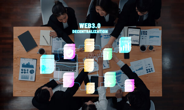 A dynamic business meeting focused on Web3.0 and decentralization. Professionals collaborate using digital tools and data analysis to innovate and strategize effectively. Trope