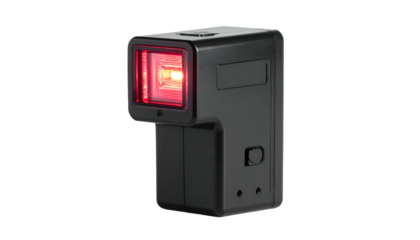 A rectangular, handheld black device with a red light, angled and isolated on black