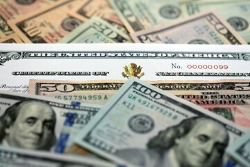 US Certificate of Naturalization on big amount of money bills close up