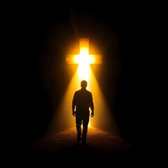 Fototapeta premium Silhouette of a man walking towards a glowing cross in a dark space or tunnel