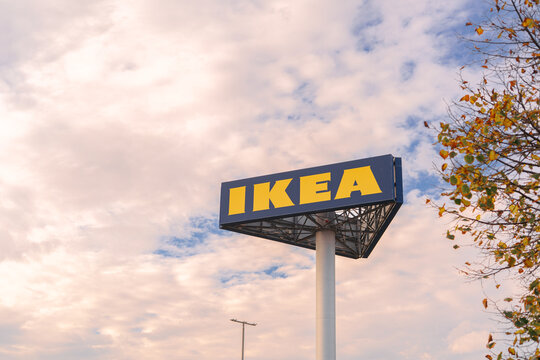 IKEA store logo sign against cloudy sky