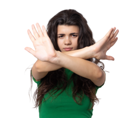 Portrait of a serious young woman showing stop gesture with her palm over white background