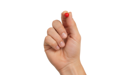 Holding a Red Object: A close-up shot of a hand holding a small, vibrant red object, showcasing delicate precision and careful handling. 