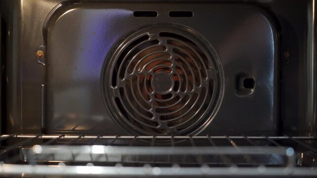 Convection Heat Starts: Oven Fan Hums Steadily for Warm, Ready Baking