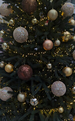 Beautiful sparkling Christmas ornament shining brightly on festive holiday tree