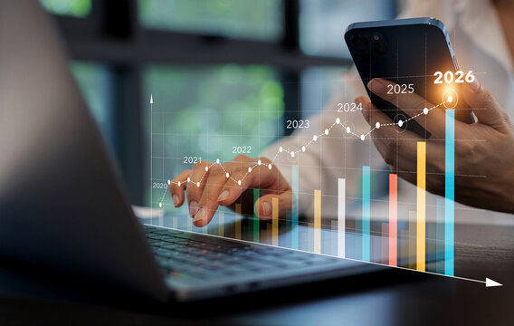 2026 Businessman analyzing company financial balance sheet working with digital virtual graphics Businessman calculating financial data for long term investment growth goals