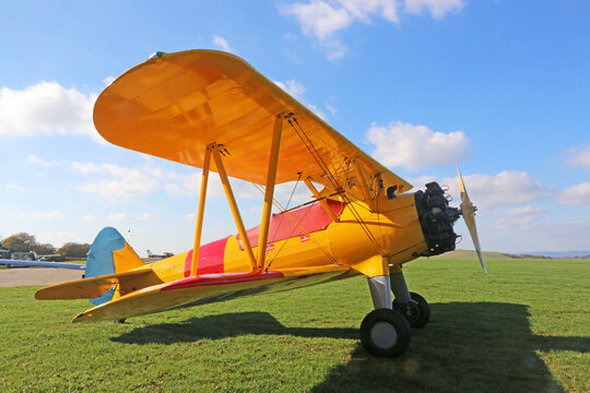 Light airplane standing on a grass runway	