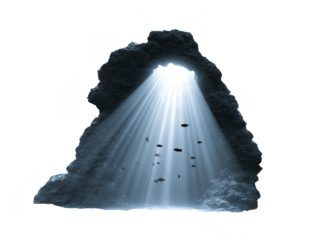 Sunlight beams penetrate through underwater cave opening, illuminating rocks and swimming fish in tranquil, mysterious aquatic scene